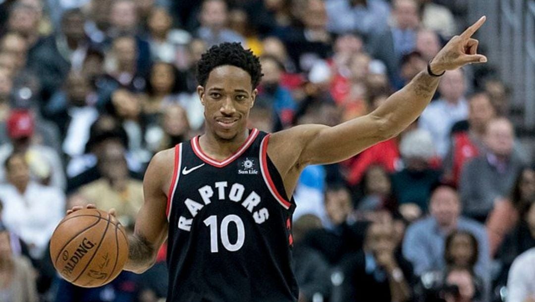 DeMar DeRozan of the Toronto Raptors directs a play to his teammates during an NBA game in March 2018.