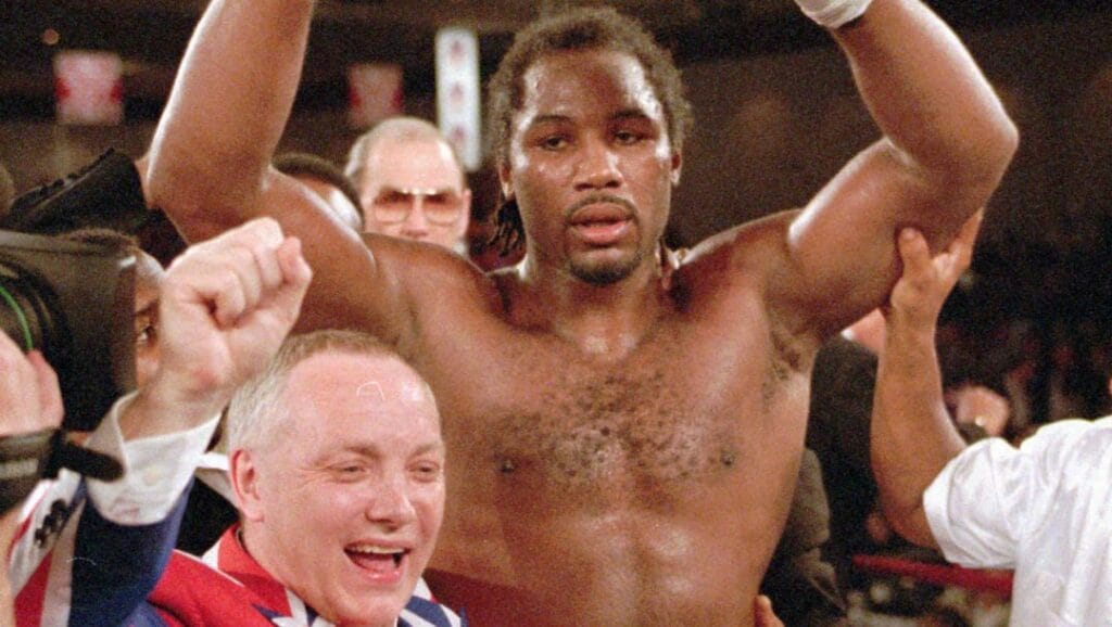 This is a Friday night, Feb. 7, 1997, file photo of WBC heavyweight champion Lennox Lewis, right, and his promoter Frank Maloney, as they celebrate his victory over Oliver McCall at the Hilton Hotel in Las Vegas.