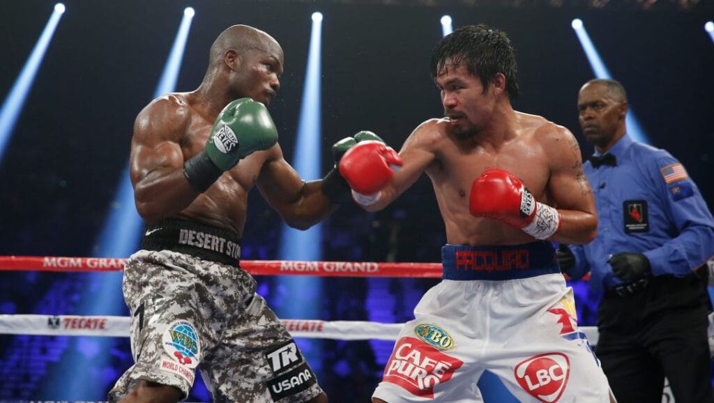 In this April 12, 2014, file photo, boxers Timothy Bradley, left, and Manny Pacquiao, of the Philippines, face off in their WBO welterweight title fight in Las Vegas