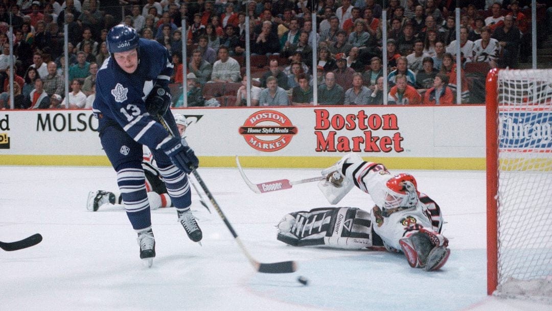 Toronto Maple Leafs' Mats Sundin (13) puts the puck past Chicago Blackhawks goalie Ed Belfour for a goal during the third period of Toronto's 5-3 victory in the first game of the teams' first-round playoff game, Sunday, May 7, 1995 in Chicago.