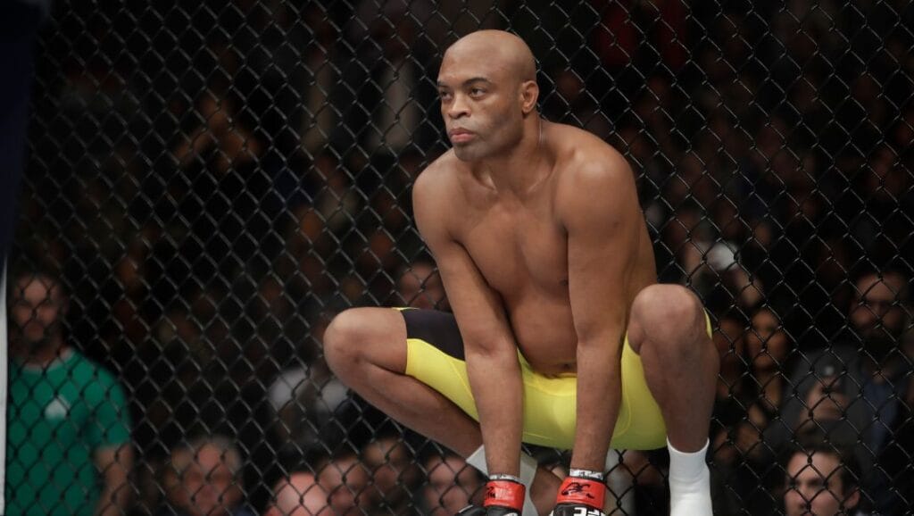 Anderson Silva, of Brazil, squats before a middleweight mixed martial arts bout against Derek Brunson at UFC 208.