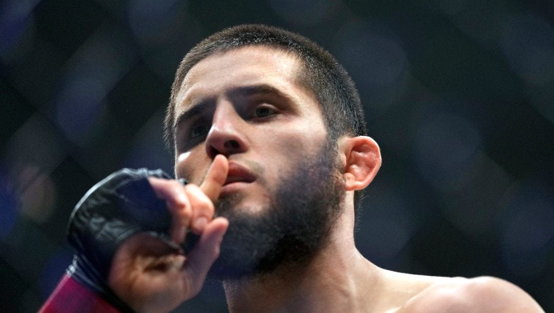 Islam Makhachev of Russia celebrates after he beats Alex Volkanovski of Australia in the UFC lightweight championship fight during UFC 294, at the Ethihad Arena in Abu Dhabi, United Arab Emirates, Saturday, Oct. 21, 2023.