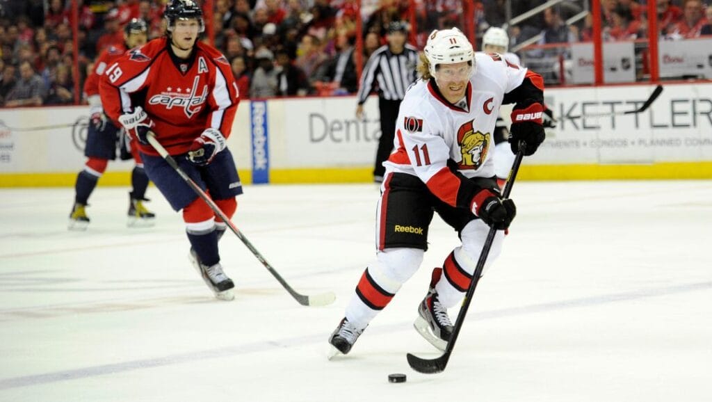 Ottawa Senators right wing Daniel Alfredsson (11), of Sweden, skates with the puck against Washington Capitals center Nicklas Backstrom (19), of Sweden, during the second period of an NHL hockey game, Thursday, April 25, 2013, in Washington.