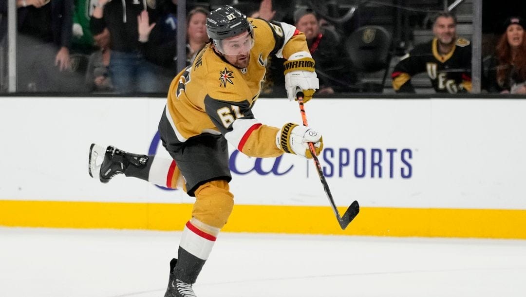 Vegas Golden Knights right wing Mark Stone (61) shoots to score against the Calgary Flames in overtime of an NHL hockey game Tuesday, Dec. 12, 2023, in Las Vegas.