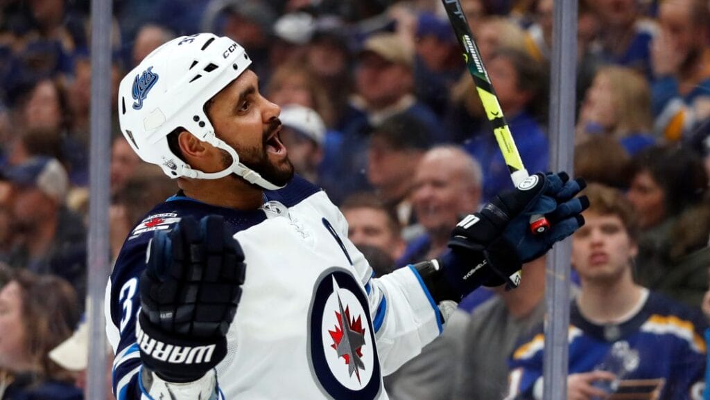 Winnipeg Jets' Dustin Byfuglien celebrates after scoring during the third period in Game 3 of an NHL first-round hockey playoff series against the St. Louis Blues Sunday, April 14, 2019, in St. Louis. The Jets won 6-3.