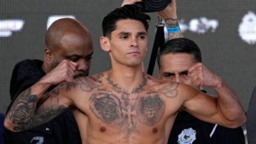 Ryan Garcia poses on the scale during a weigh-in Friday, April 21, 2023, in Las Vegas. Garcia is scheduled to fight Gervonta Davis.