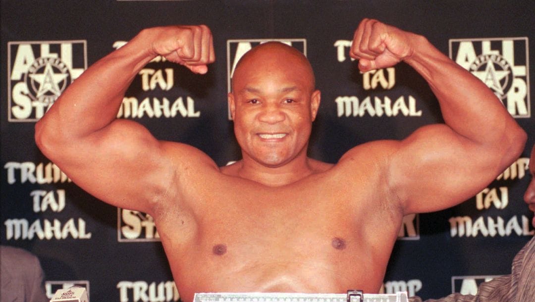 Heavyweight boxer George Foreman flexes his muscles after weighing in at 260 pounds for his upcoming fight against Shannon Briggs.