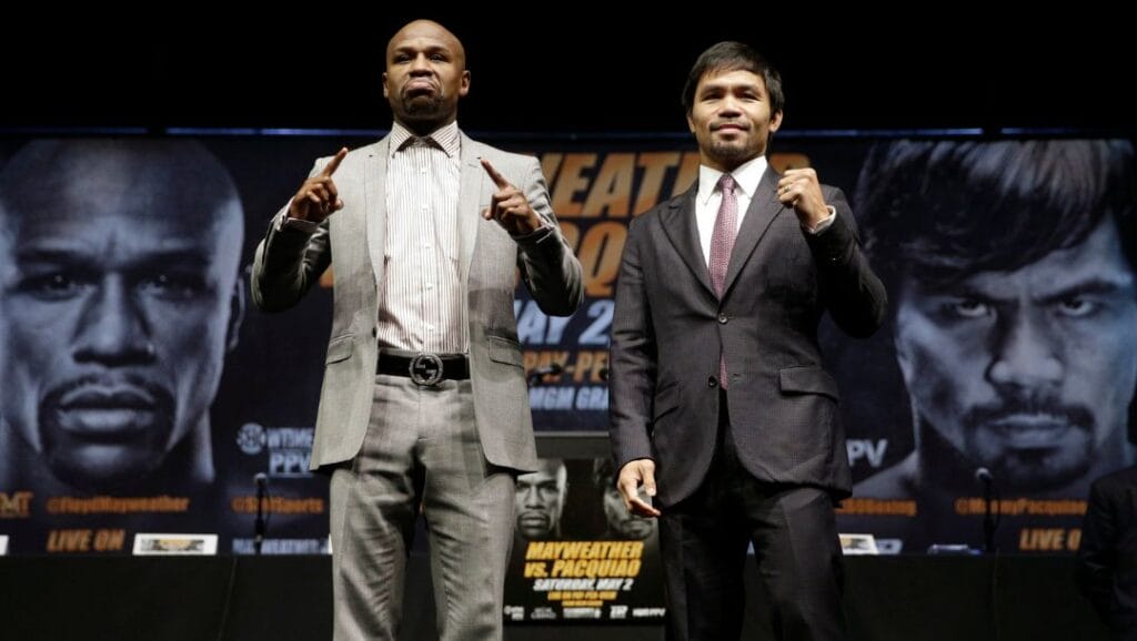 In this March 11, 2015, file photo, boxers Floyd Mayweather Jr., left, and Manny Pacquiao, of the Philippines, pose for photos.