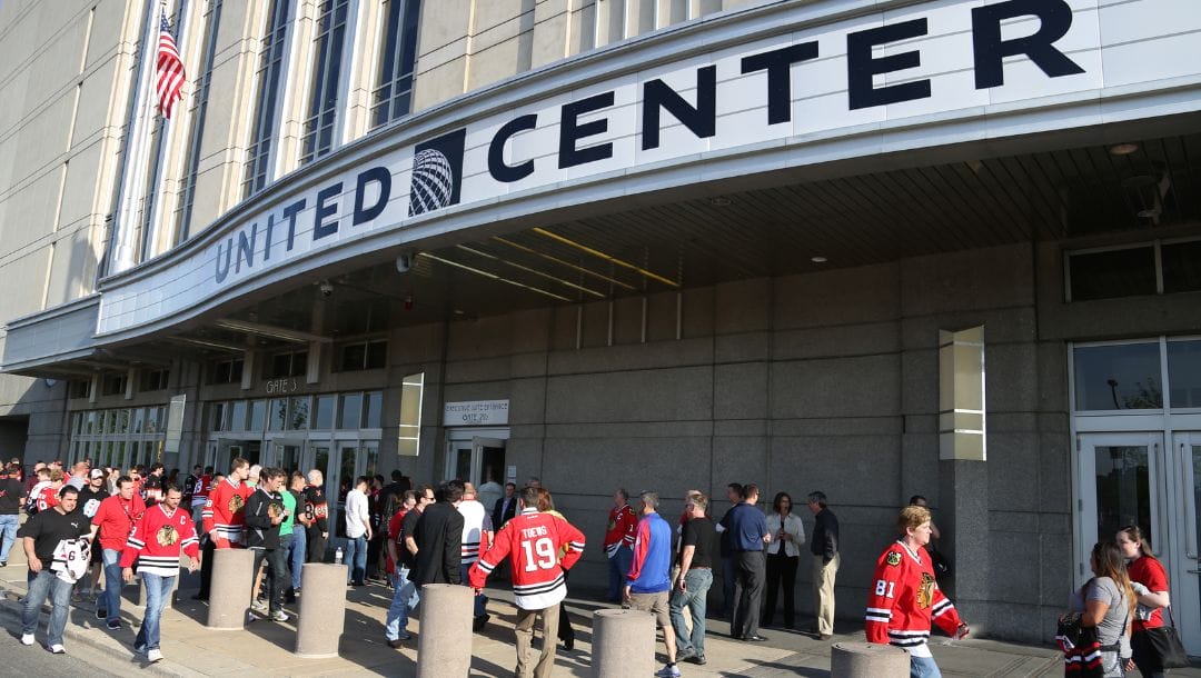 Blackhawks fans make their way into the United center to see the Blackhawks defeat the Red Wings 2-1 in overtime in Game 7.