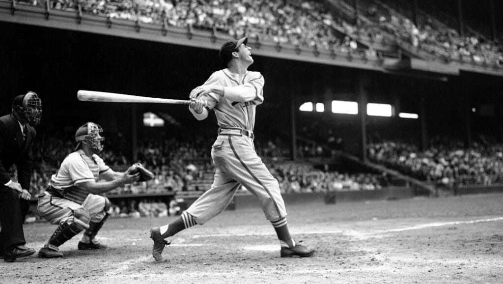 In this May 22, 1946 file photo, St. Louis Cardinals' Stan Musial bats against the Philadelphia Phillies during a baseball game at Shibe Park in Philadelphia.