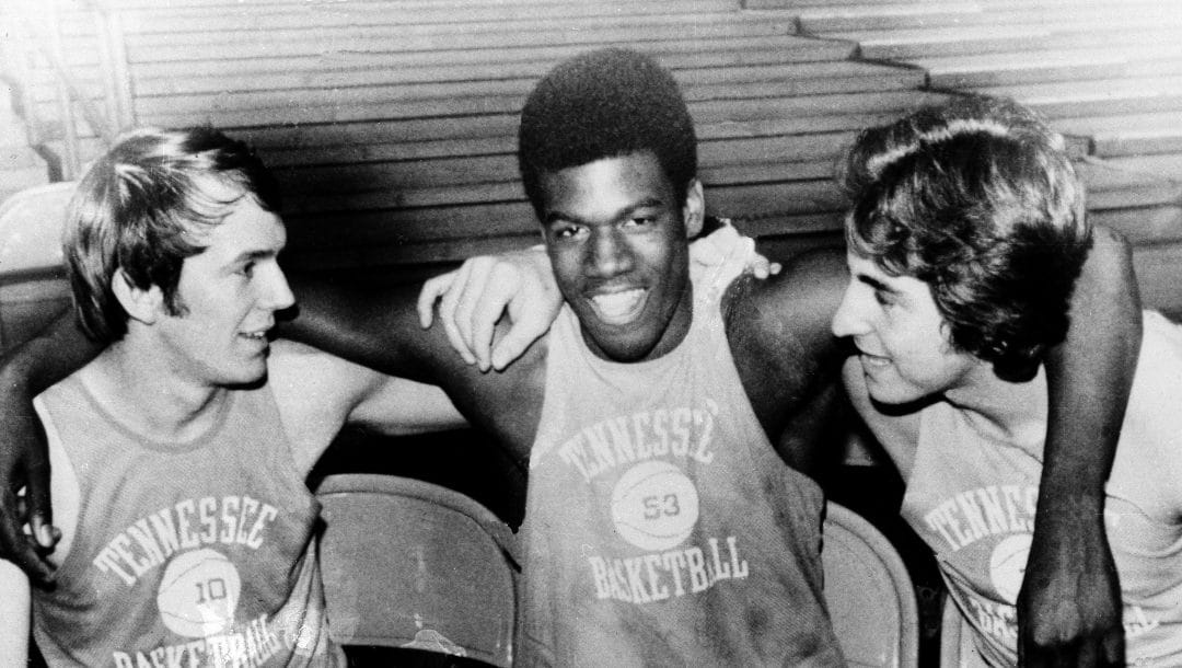 Freshman basketball sensation Bernard King, center, is welcomed back to active duty status Wednesday, Feb. 5, 1975 in Knoxville, Tenn., by teammates Rodney Woods, left, and Ernie Grunfeld.