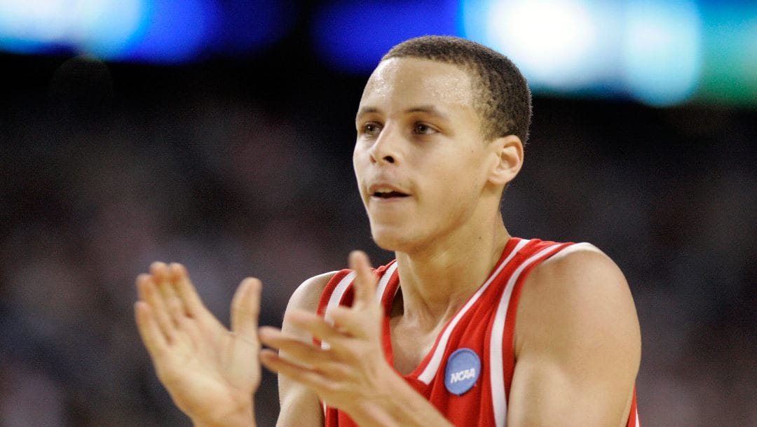 Davidson's Stephen Curry celebrates near the end of their win over Wisconsin in an NCAA Midwest Regional semifinal basketball game Friday, March 28, 2008, in Detroit.