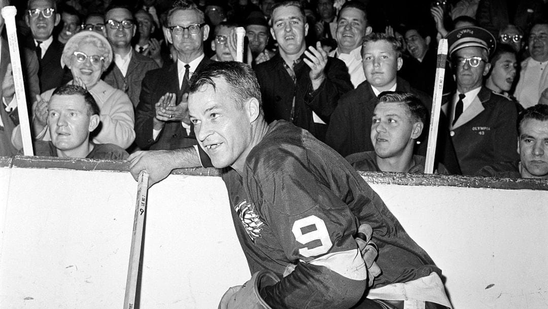 In this Nov. 10, 1963 file photo, the Detroit Red Wings' Gordie Howe (9) acknowledges applause from the fans during a 20-minute standing ovation after he scored the 545th cgoal of his National Hockey League career at Detroit's Olympia Stadium, to set the leagues' to set the all-time scoring mark.