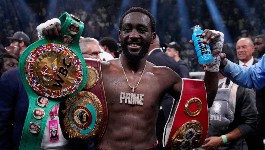 Terence Crawford celebrates his defeat of Errol Spence Jr. after their undisputed welterweight championship boxing match.
