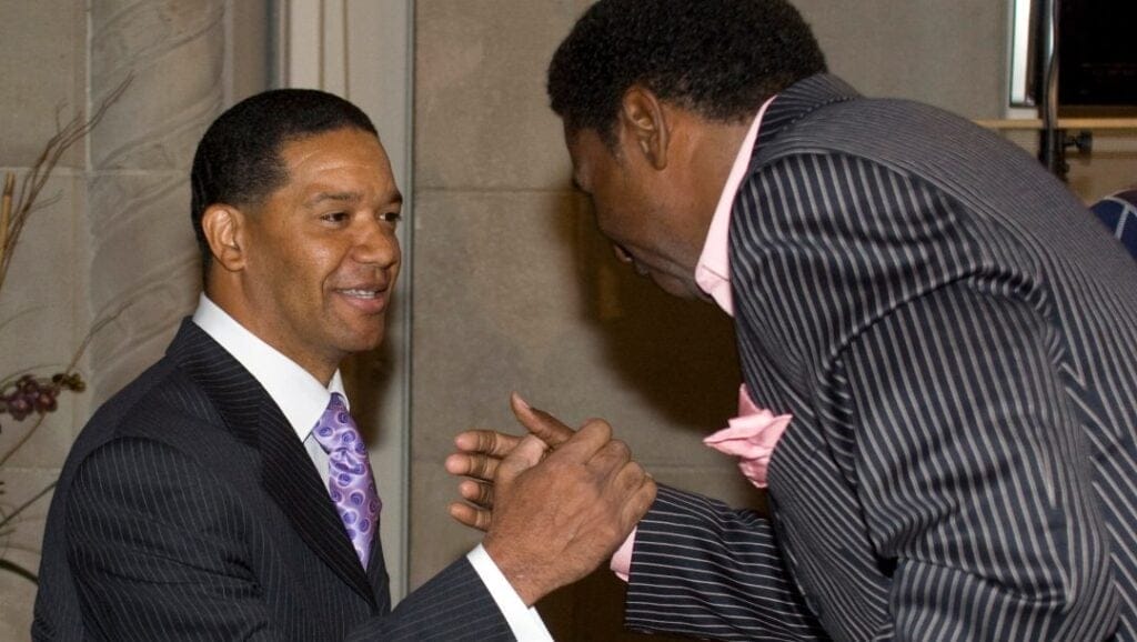 Quarterback Damon Allen (left) is greeted by Toronto Argonauts CEO Mike (Pinball) Clemons as he arrives to announce his retirement from the Canadian Football League in Toronto, Wednesday May 28, 2008.