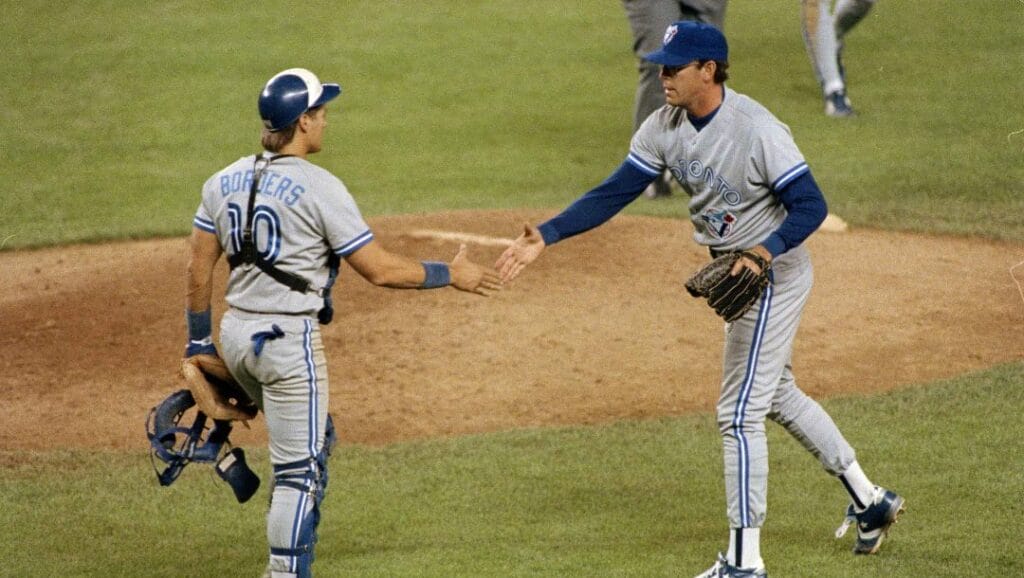Toronto Blue Jays relief pitcher Tom Henke, right, is congratulated by catcher Pat Borders after pitching a scoreless ninth inning to preserve the Blue Jays 2-1 win over the New York Yankees, June 10, 1992. Henke has 12 saves this season.