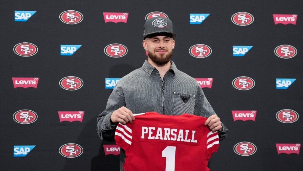 San Francisco 49ers first round draft pick Ricky Pearsall Jr. holds a jersey during an NFL football news conference, Friday, April 26, 2024, at the team's facility in Santa Clara, Calif.