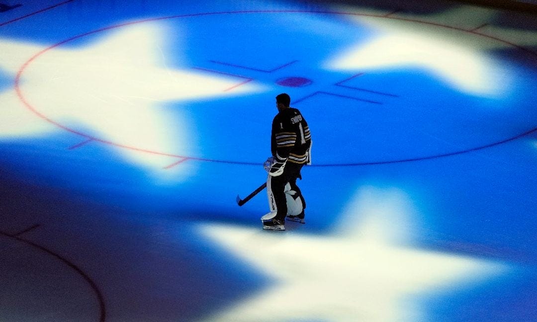 Boston Bruins' Jeremy Swayman stands on the ice during the U.S. national anthem before Game 1 of the team's NHL hockey Stanley Cup first-round playoff series against the Toronto Maple Leafs, Saturday, April 20, 2024, in Boston.