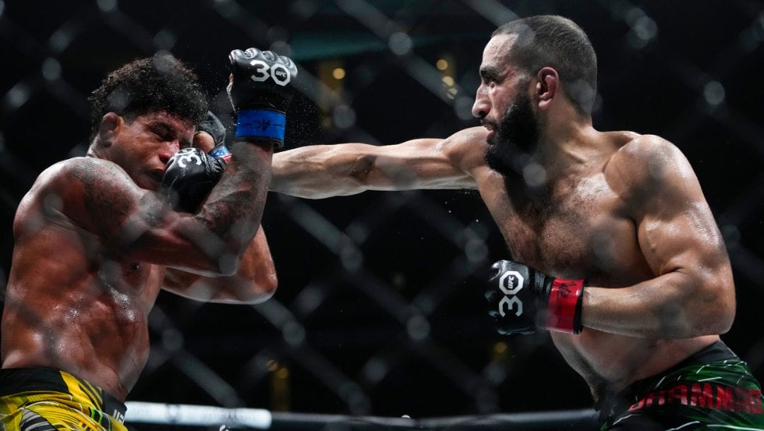 Belal Muhammad, right, punches Brazil's Gilbert Burns during the fourth round of a welterweight bout at the UFC 288.