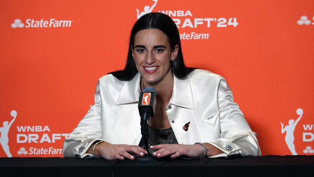 Caitlin Clark answers questions at her press conference moments after being selected first in the 2024 WNBA Draft.