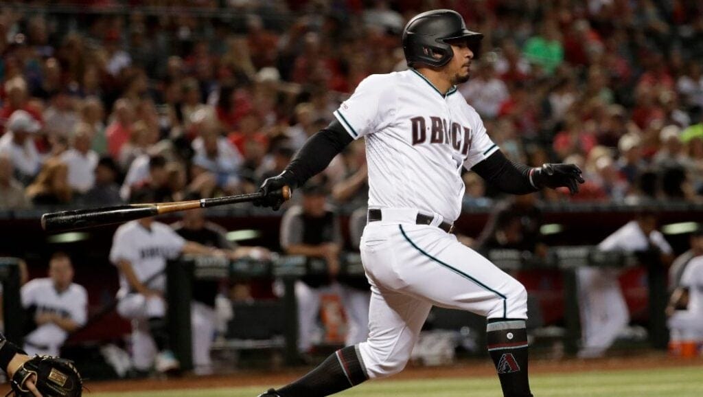 Arizona Diamondbacks' Eduardo Escobar follows through on a base hit against the St. Louis Cardinals during the seventh inning of a baseball game, Tuesday, Sept. 24, 2019, in Phoenix.