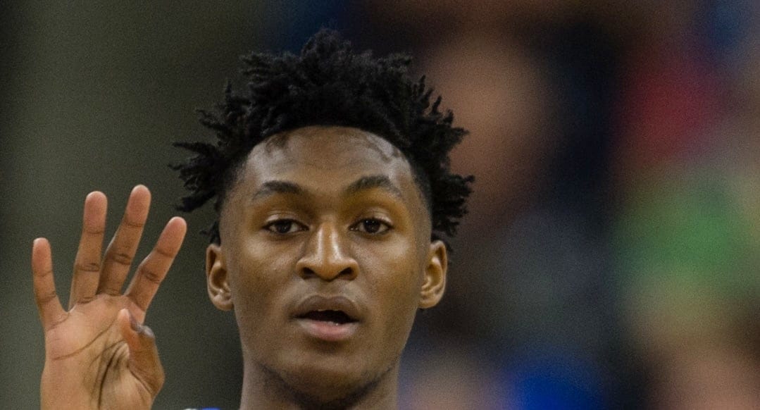Immanuel Quickley playing for the University of Kentucky Wildcats basketball team calls a play during a game on March 23, 2019.