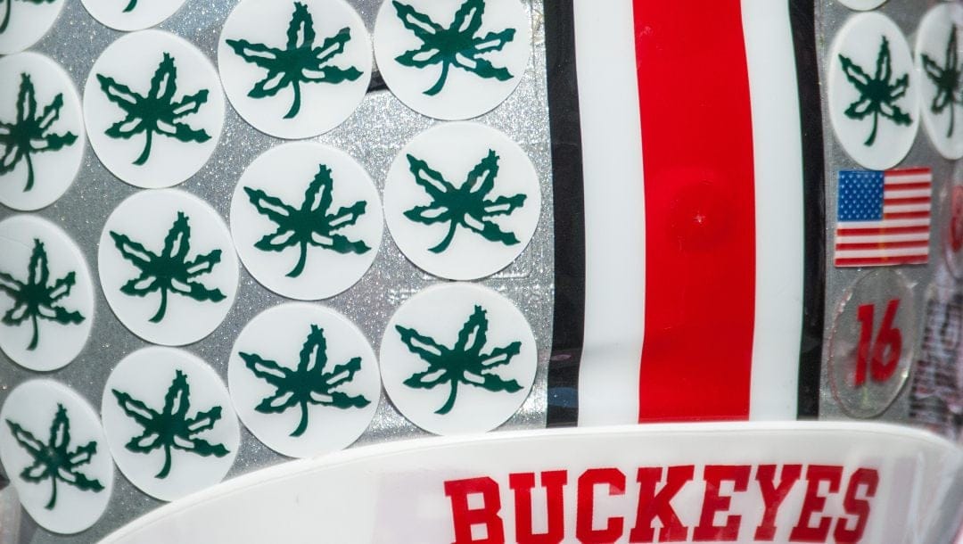 An Ohio State helmet sits on a bench during an NCAA football game against Illinois Saturday, Nov. 14, 2015 at Memorial Stadium in Champaign, Ill. Ohio State won 28-3.