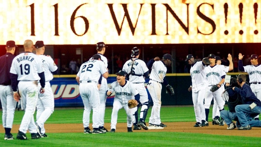 The Seattle Mariners celebrate after beating the Texas Rangers 1-0 in Seattle, Oct. 6, 2001, their 116th win to tie the Major League record with the 1906 Chicago Cubs for most wins in a season.