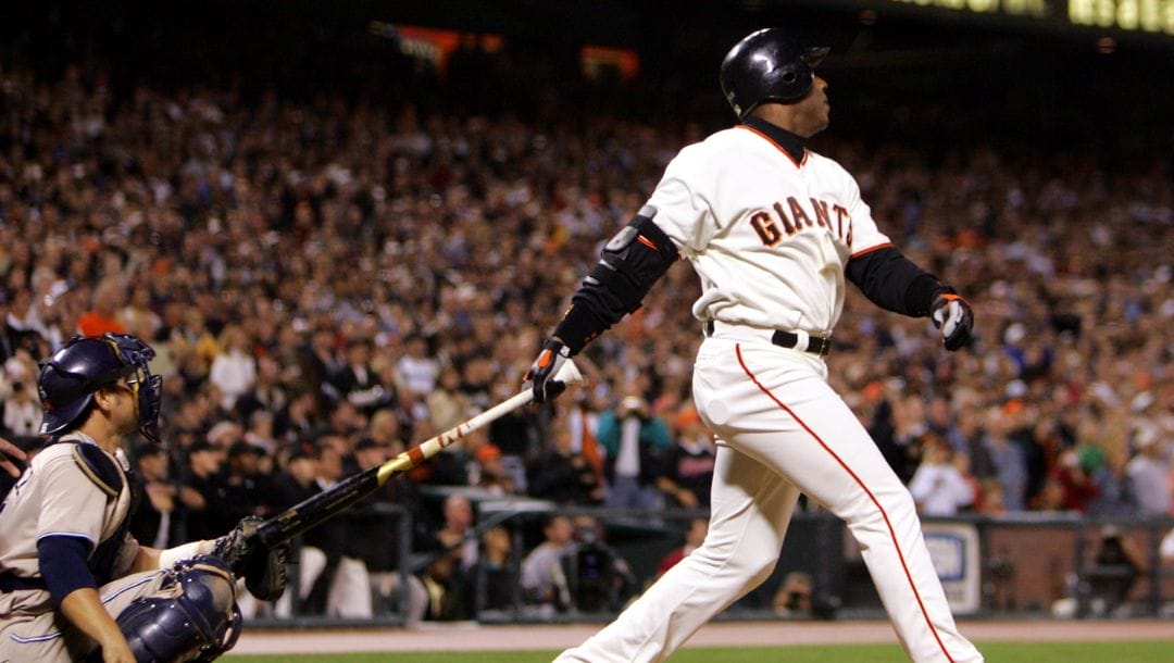 San Francisco Giants' Barry Bonds follows his 700th career home run off San Diego Padres' pitcher John Peavy.