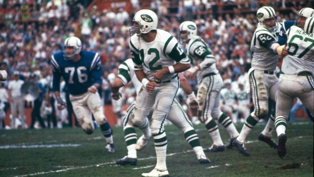 New York Jets quarterback (12) Joe Namath gets off a pass under pressure from the Baltimore Colts defenders during Super Bowl III in Miami, Fla., on Sunday, Jan. 12, 1969.