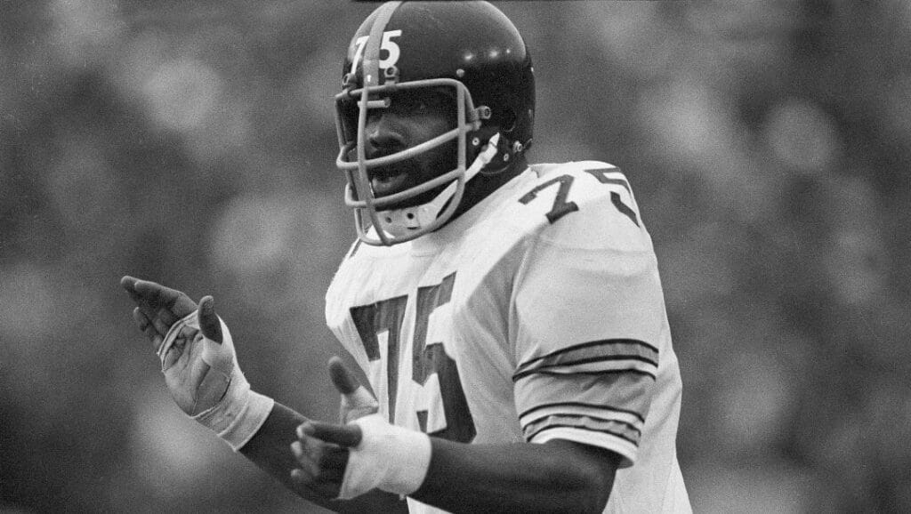 In this Jan. 13, 1975, file photo, Pittsburgh Steelers' tackle "Mean" Joe Greene encourages his teammates during the Super Bowl game against the Minnesota Vikings at Tulane Stadium in New Orleans.