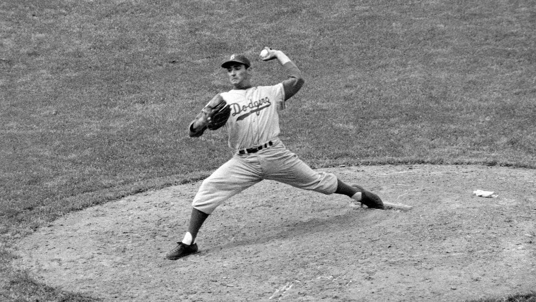 Southpaw Sandy Koufax of the Brooklyn Dodgers, who ended his bonus tenure the day before, displays his pitching form in the eighth inning Thursday, May 16, 1957 in Chicago. Koufax struck out 13 Cubs and checked Chicago on four hits as Dodgers won 3-2. The game matched the National League record of 23 strikeouts for both clubs.