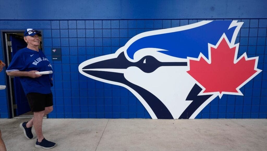 A fan arrives at TD Ballpark before a spring training baseball game between the Toronto Blue Jays and the Philadelphia Phillies Thursday, Feb. 29, 2024, in Dunedin, Fla.