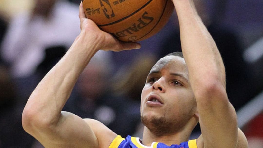 Golden State Warriors superstar Stephen Curry shooting the ball in an NBA game in March 2011.