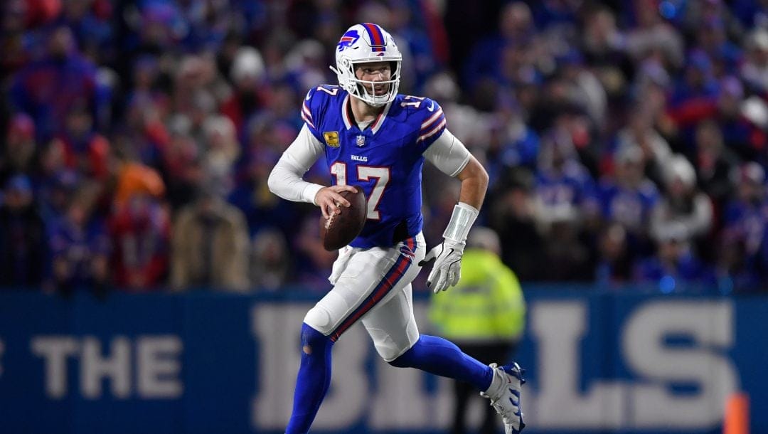 Buffalo Bills quarterback Josh Allen (17) runs with the ball during the second half of an NFL football game against the Kansas City Chiefs in Orchard Park, N.Y., Sunday, Nov. 17, 2024.