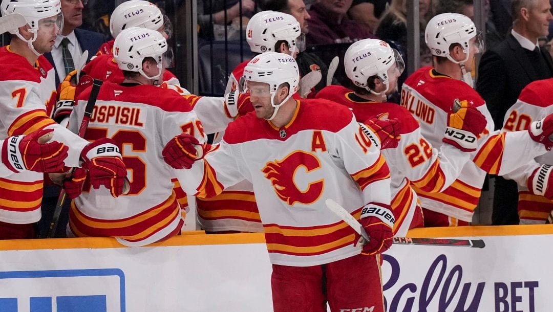 Calgary Flames center Jonathan Huberdeau (10) celebrates his goal during the second period of an NHL hockey game against the Nashville Predators, Tuesday, Dec. 10, 2024, in Nashville, Tenn.