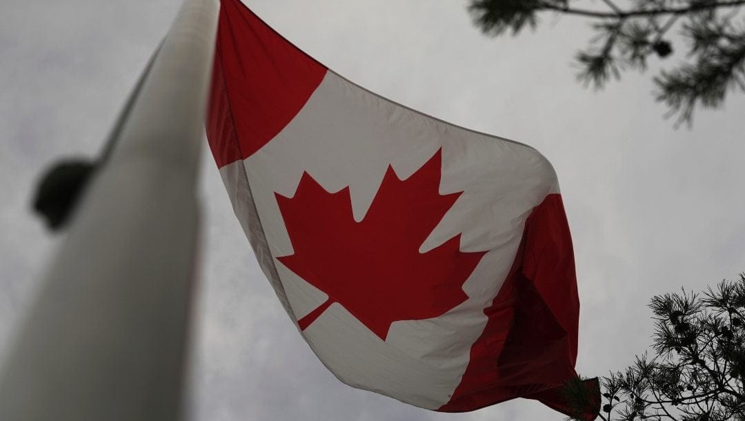 The Canadian flag is blown by wind on Centre Island in Toronto on Thursday, Sept. 19, 2024.