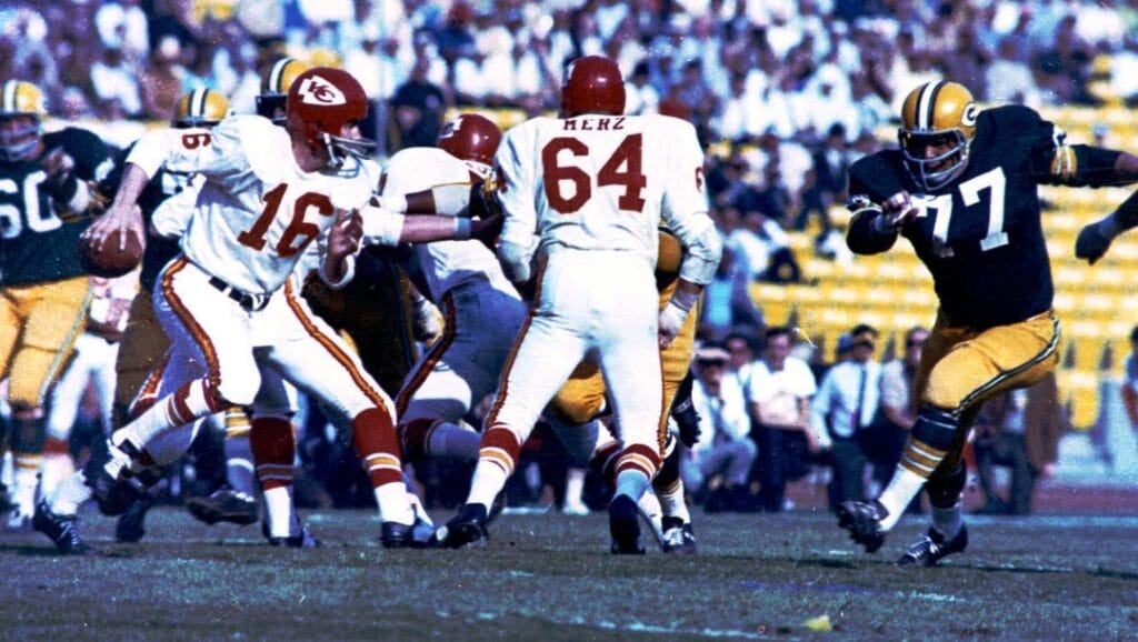 Kansas City Chiefs quarterback Len Dawson (16) looks for an opening, Jan. 15, 1967 in Super Bowl I game against Green Bay Packers, at Los Angeles Califonia's Memorial Coliseum. Other players are unidentified. The Packers won, 35-10.