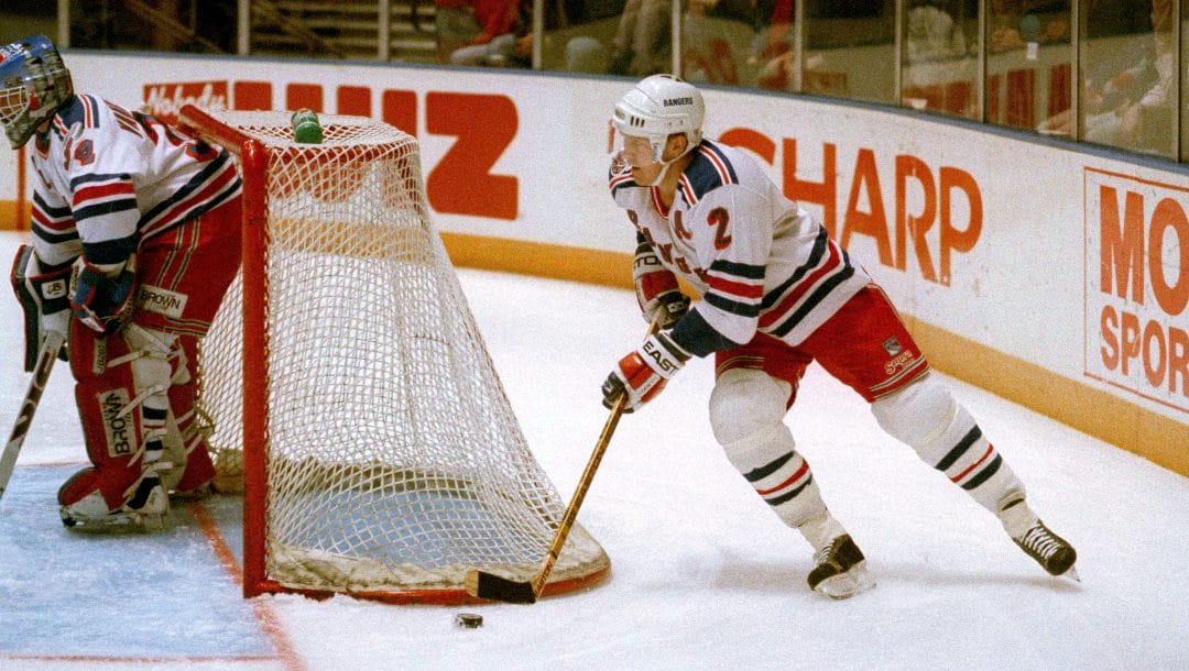 All-Star defenseman Brian Leetch takes the puck around the net as he returned to the line-up for the game against the Los Angeles Kings at Madison Square Garden in New York, March 9, 1993. Leetch last played on Dec. 17 when he suffered nerve damage in the area of his neck and left shoulder and had since missed 34 games.
