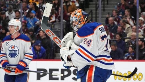 Edmonton Oilers goaltender Stuart Skinner, front, reacts as time runs out in the third period as Edmonton Oilers defenseman Ty Emberson looks on in an NHL hockey game against the Colorado Avalanche Thursday, Jan. 16, 2025, in Denver.