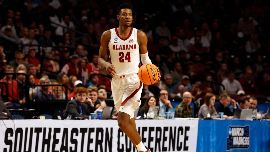 Alabama forward Brandon Miller (24) dribbles the ball in the first half of a second-round college basketball game against Maryland in the NCAA Tournament in Birmingham, Ala., Saturday, March 18, 2023.
