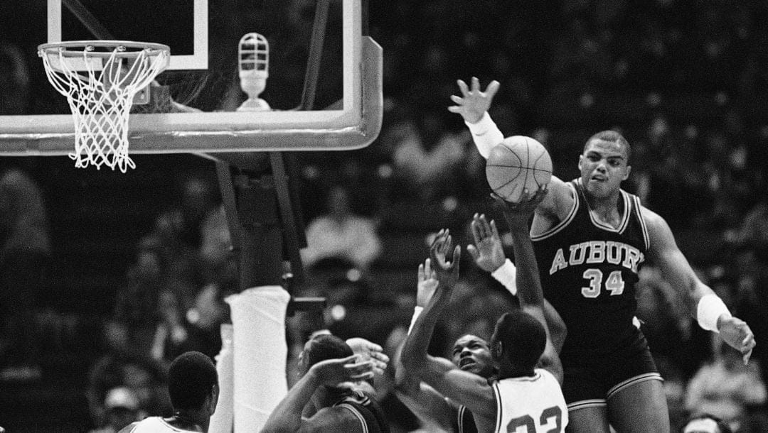 Auburn's Charles Barkley (34) goes high to block a shot on goal by Alabama's Buck Johnson (32) during the first period.