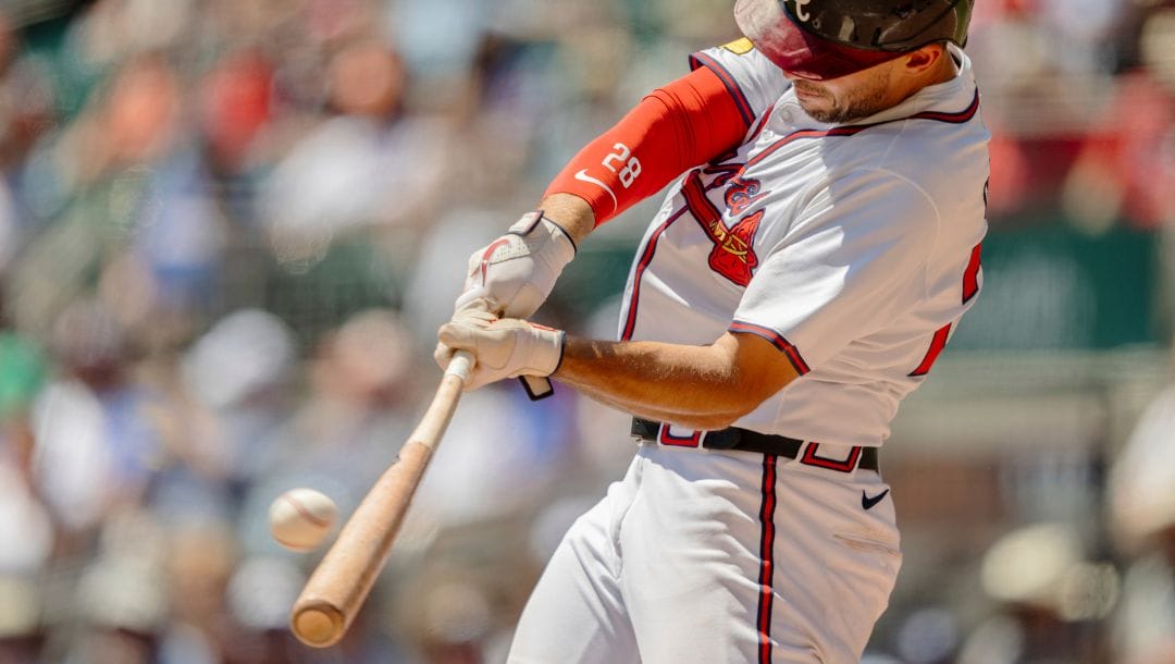 Atlanta Braves' Matt Olson hits a home run in the sixth inning of a baseball game against the Washington Nationals.