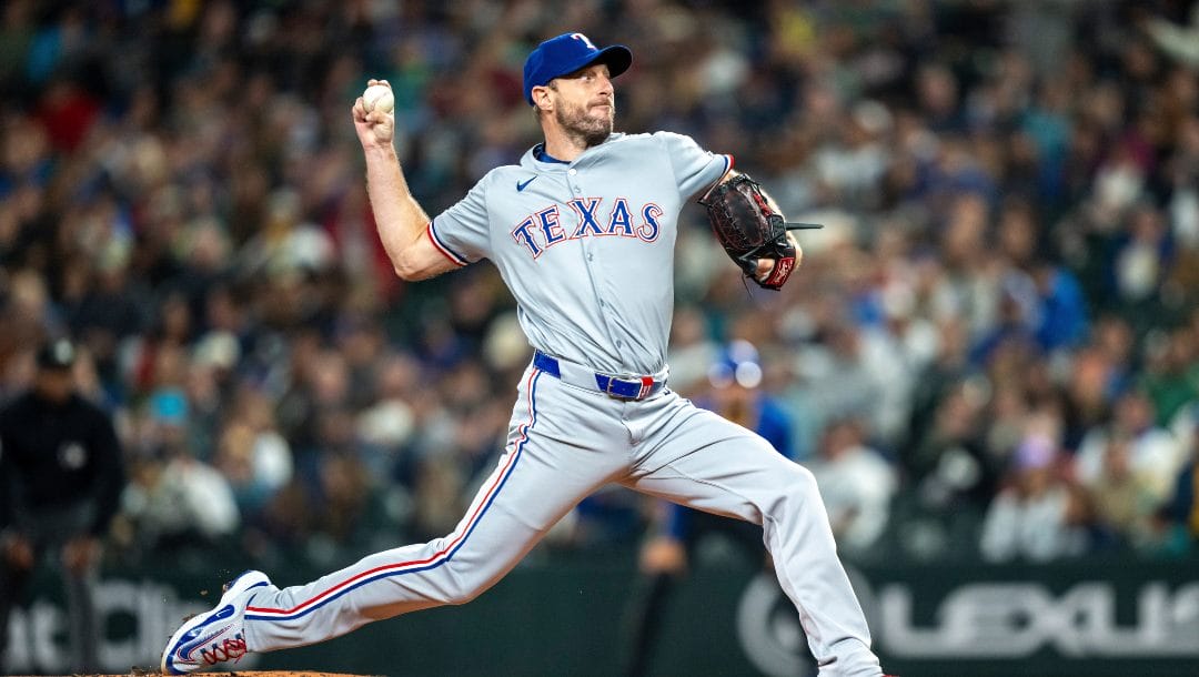 Texas Rangers starter Max Scherzer delivers a pitch during a baseball game against the Seattle Mariners, Sept. 14, 2024, in Seattle.