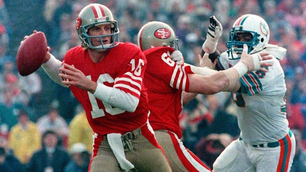 FILE - In this Jan. 20, 1985, file photo, San Francisco 49ers quarterback Joe Montana (16) looks for a receiver.