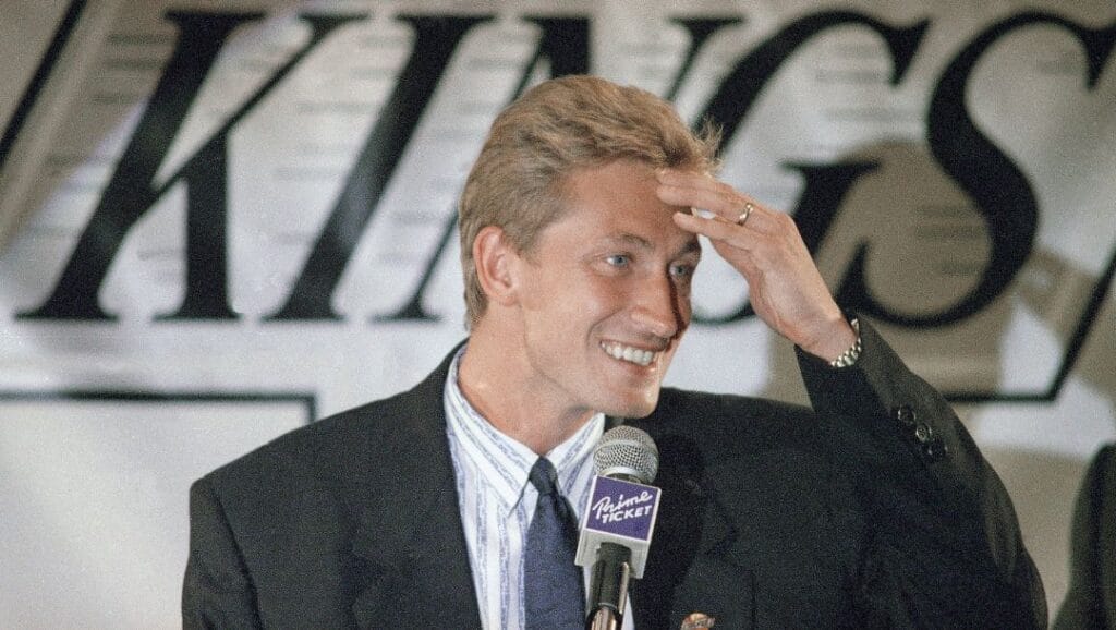 Wayne Gretzky smiles as he meets the press in Los Angeles, Aug. 10, 1988, after being traded to the Los Angeles Kings.