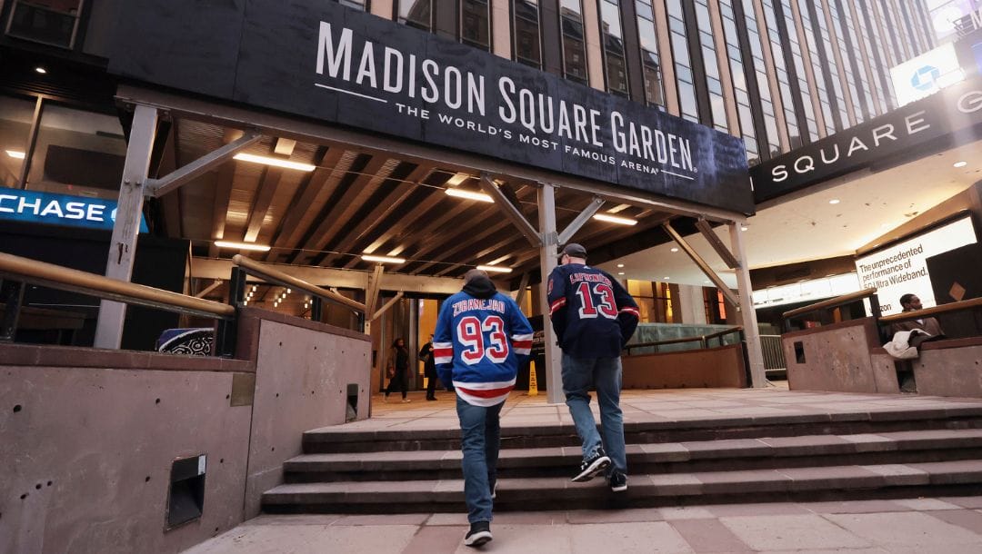 Fans head toward Madison Square Garden before an NHL hockey game between the New York Rangers and the Boston Bruins on Friday.