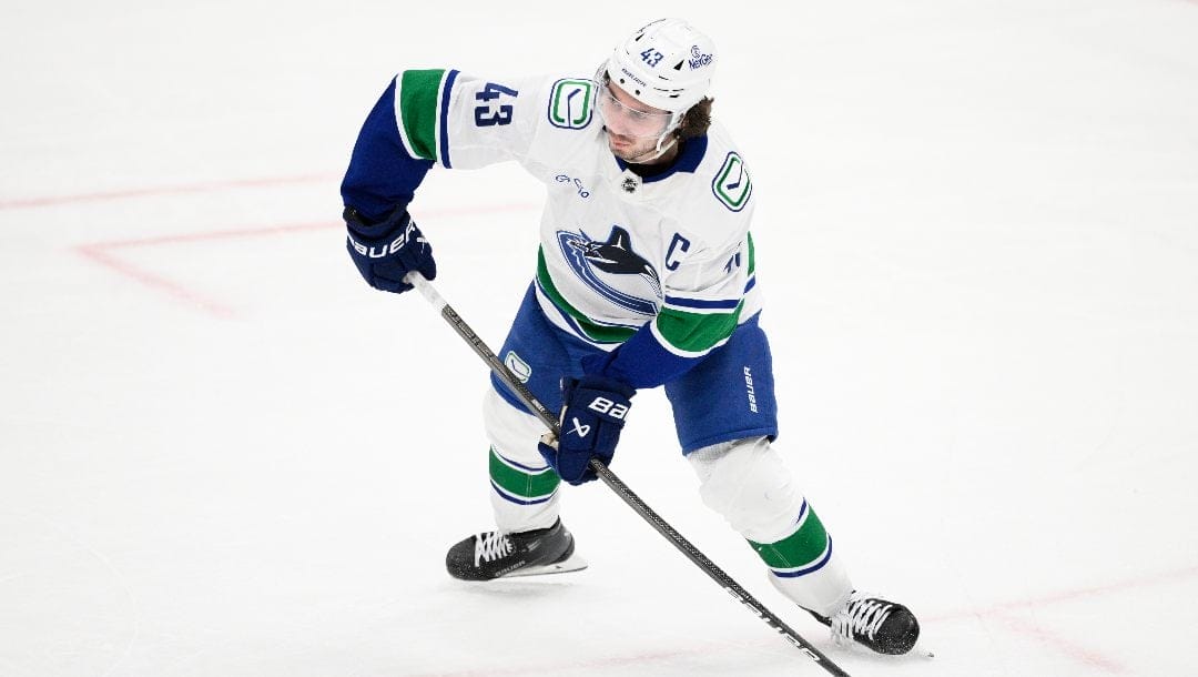 Vancouver Canucks defenseman Quinn Hughes (43) in action during the third period of an NHL hockey game against the Washington Capitals, Wednesday, Jan. 8, 2025, in Washington. The Capitals won 2-1 in overtime.