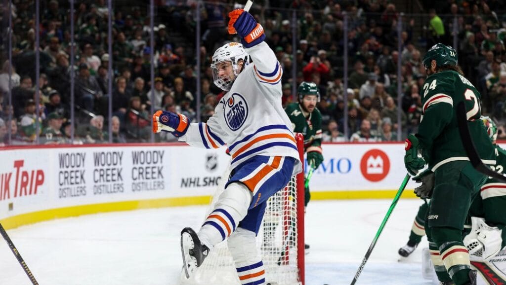 Edmonton Oilers left wing Zach Hyman, middle, celebrates his goal during the first period of an NHL hockey game.