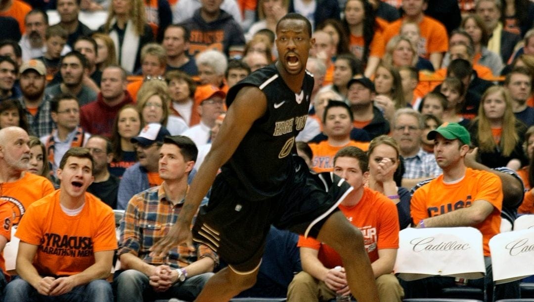 High Point’s John Brown yells as he runs downcourt after scoring a basket against Syracuse in the second half of an NCAA college basketball game in Syracuse, N.Y., Friday, Dec. 20, 2013.